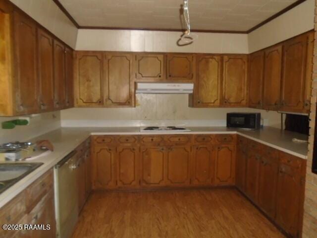 1248 N Portage Rd, Arnaudville, LA 70512 - kitchen with black microwave, exhaust hood, brown cabinetry, crown molding, and light wood-style floors