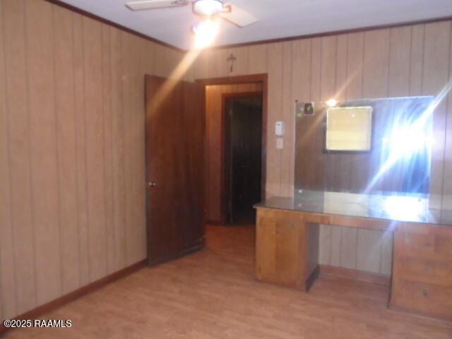 1248 N Portage Rd, Arnaudville, LA 70512 - unfurnished office featuring ceiling fan, light wood finished floors, and wooden walls