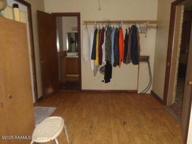 1248 N Portage Rd, Arnaudville, LA 70512 - corridor featuring wood finished floors and baseboards
