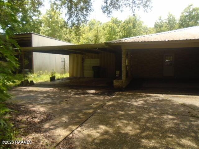 1248 N Portage Rd, Arnaudville, LA 70512 - view of vehicle parking with concrete driveway