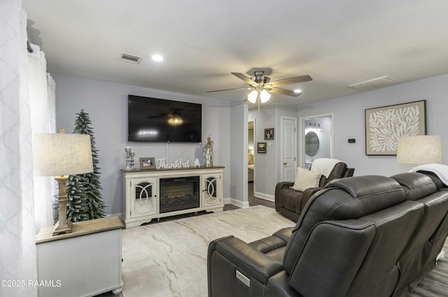 411 Donald St, New Iberia, LA 70563 - living room featuring ceiling fan and baseboards