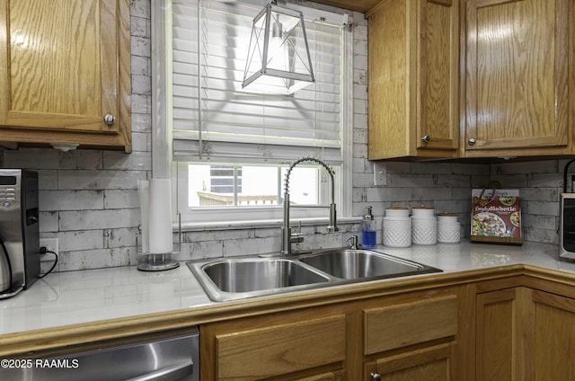 411 Donald St, New Iberia, LA 70563 - kitchen with dishwasher, brown cabinetry, and light countertops
