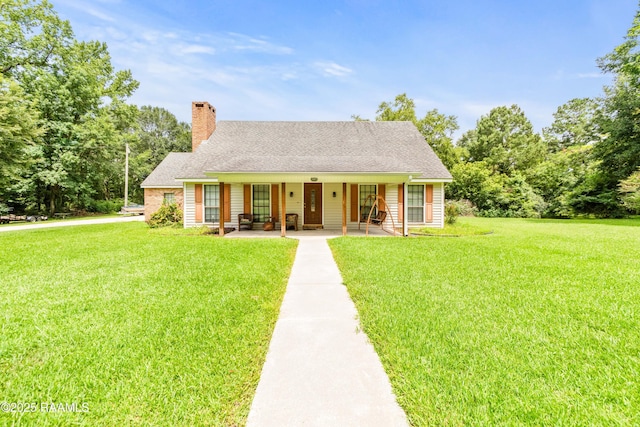 3317 Walnut Dr, Opelousas, LA 70570 - view of front of home featuring covered porch, a front lawn, a chimney, and roof with shingles