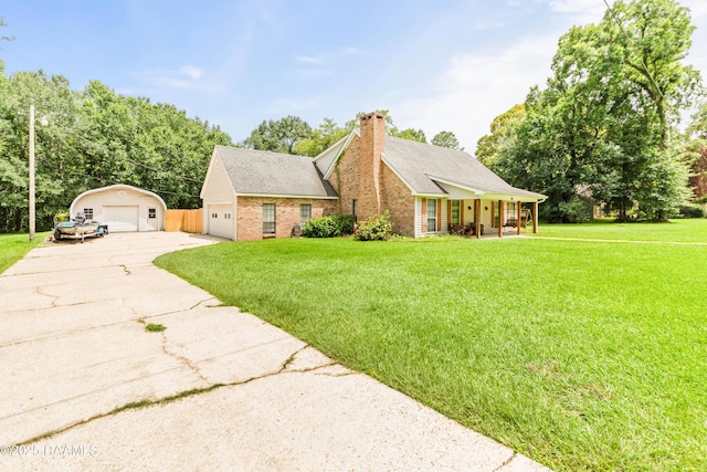 3317 Walnut Dr, Opelousas, LA 70570 - view of front of house with a garage, covered porch, a front lawn, a chimney, and brick siding