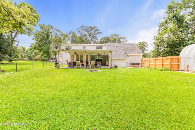 3317 Walnut Dr, Opelousas, LA 70570 - back of house featuring a ceiling fan, a fenced backyard, and a patio area