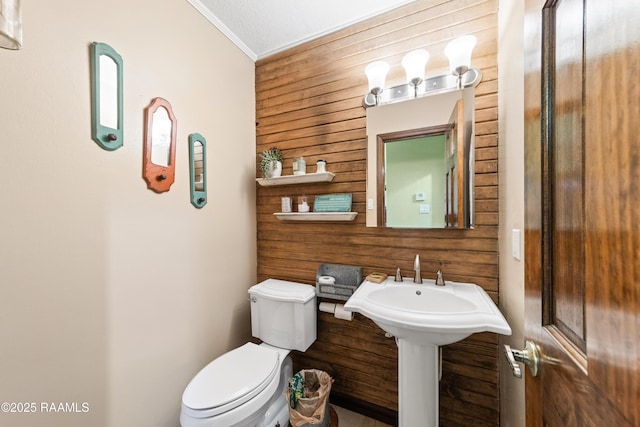3317 Walnut Dr, Opelousas, LA 70570 - bathroom featuring wooden walls and ornamental molding