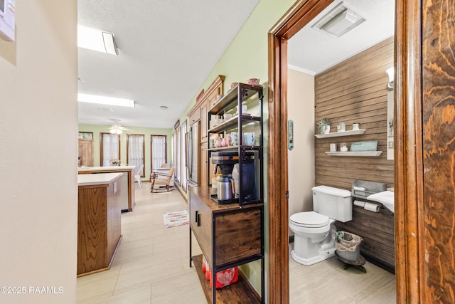 3317 Walnut Dr, Opelousas, LA 70570 - bathroom featuring wood walls and vanity