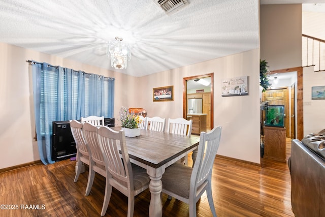 3317 Walnut Dr, Opelousas, LA 70570 - dining area with a chandelier and wood finished floors