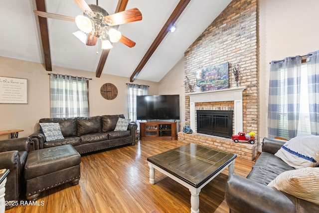 3317 Walnut Dr, Opelousas, LA 70570 - living room featuring ceiling fan, wood finished floors, beamed ceiling, high vaulted ceiling, and a brick fireplace