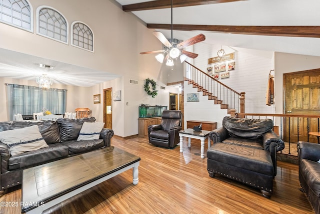 3317 Walnut Dr, Opelousas, LA 70570 - living area with a chandelier, light wood finished floors, ceiling fan, high vaulted ceiling, and beam ceiling