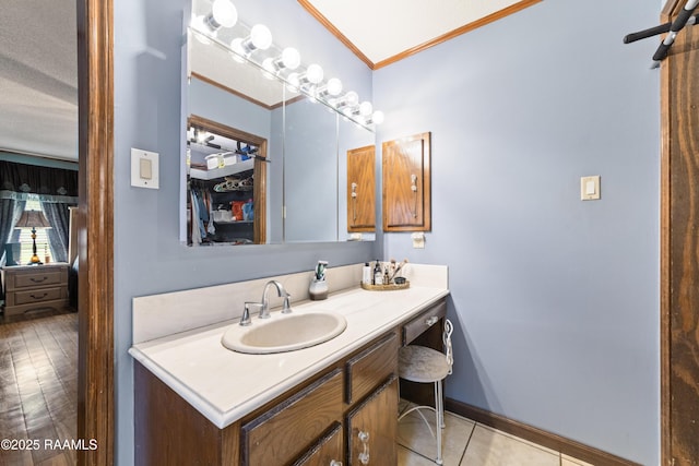 3317 Walnut Dr, Opelousas, LA 70570 - bathroom featuring vanity, ornamental molding, and tile patterned floors