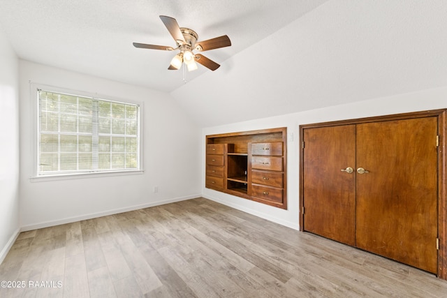 3317 Walnut Dr, Opelousas, LA 70570 - unfurnished bedroom featuring light wood-style flooring, lofted ceiling, and ceiling fan