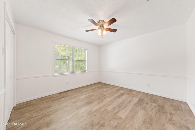 3317 Walnut Dr, Opelousas, LA 70570 - unfurnished bedroom featuring wood finished floors, a textured ceiling, and ceiling fan