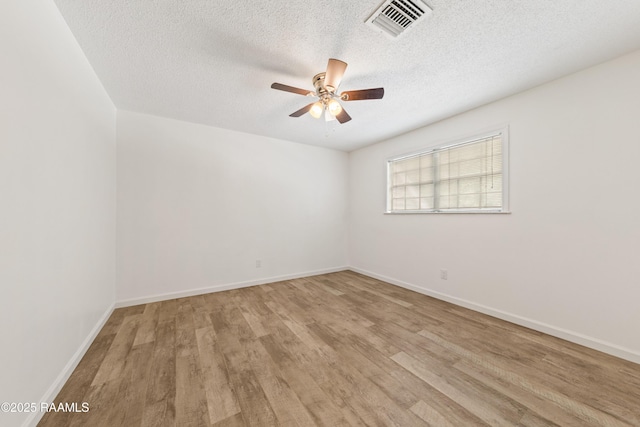 3317 Walnut Dr, Opelousas, LA 70570 - unfurnished room featuring a ceiling fan, wood finished floors, and a textured ceiling