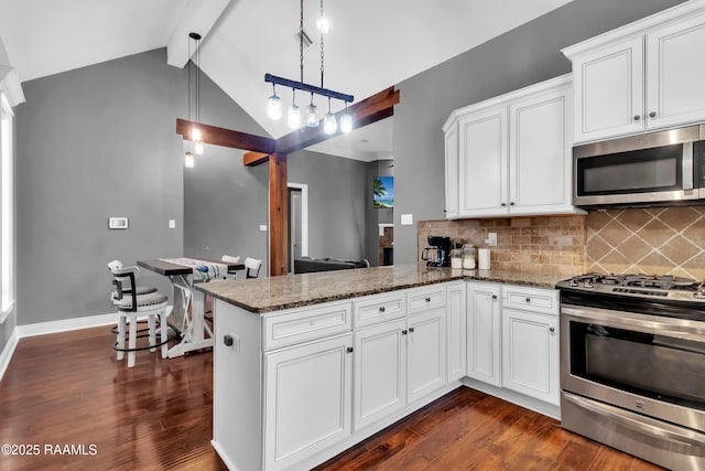 103 Cane Creek Dr, Broussard, LA 70518 - kitchen with stainless steel appliances, dark wood-type flooring, stone countertops, and a peninsula