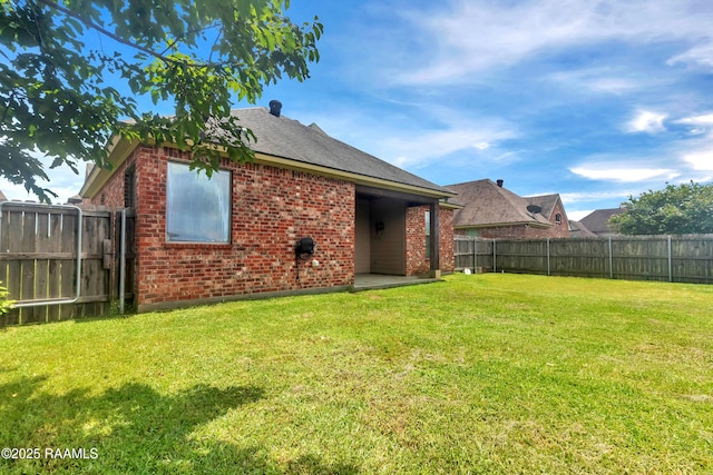 103 Cane Creek Dr, Broussard, LA 70518 - rear view of property with brick siding, a fenced backyard, and roof with shingles