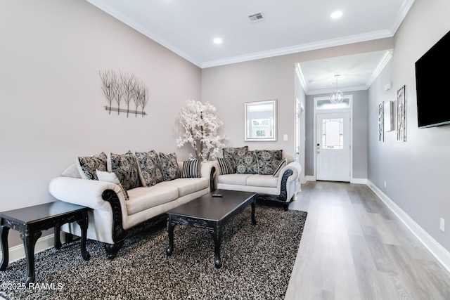 202 Saint Matthias Dr, Carencro, LA 70520 - living area with wood finished floors, crown molding, recessed lighting, and a chandelier