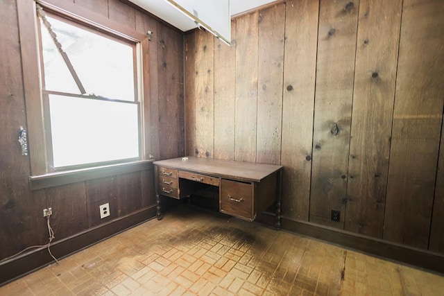 1867 N Old 179, Whigham, GA 39897 - unfurnished office with wooden walls and brick patterned flooring
