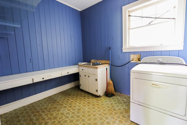 1867 N Old 179, Whigham, GA 39897 - washroom with washer / dryer, light floors, cabinet space, and wooden walls