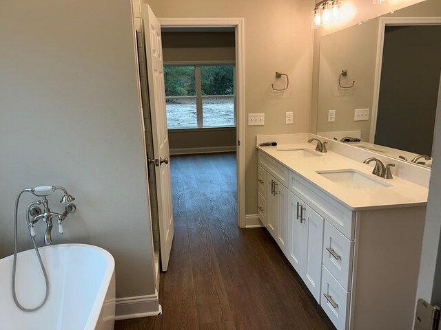 full bathroom featuring shower / washtub combination, vanity, wood-type flooring, and toilet