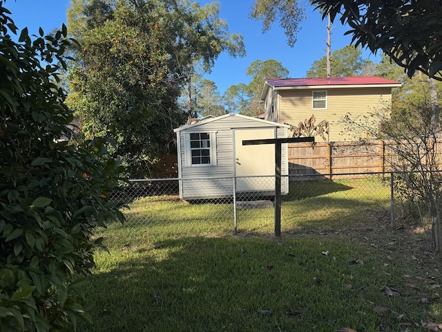 view of side of home featuring a shed and a lawn