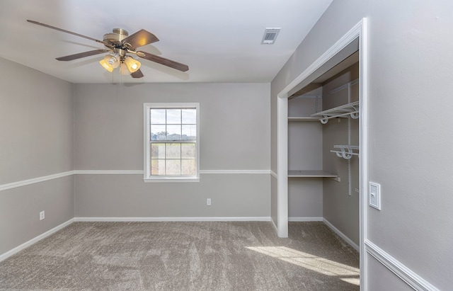 unfurnished bedroom with ceiling fan, a closet, and light colored carpet