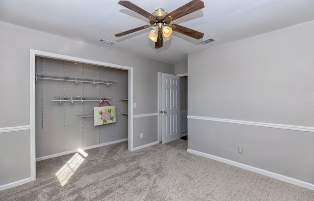 unfurnished bedroom with light carpet, a closet, and ceiling fan