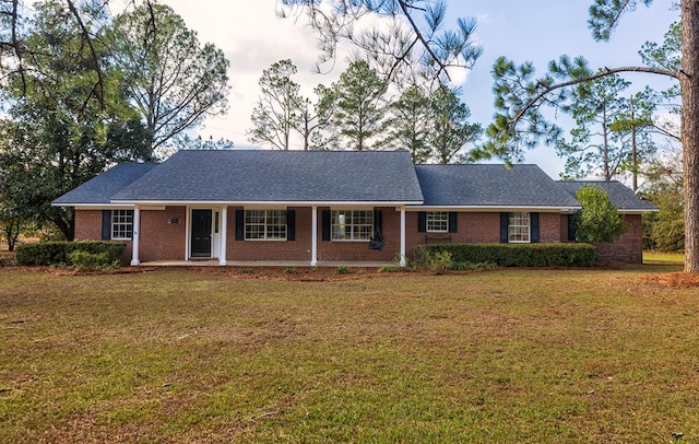 ranch-style home featuring a front yard