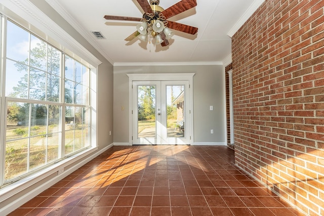 doorway to outside featuring ceiling fan, french doors, brick wall, and ornamental molding