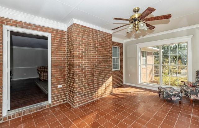 unfurnished sunroom featuring ceiling fan