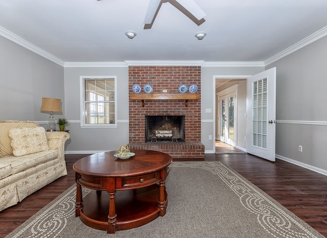 living room featuring a brick fireplace, dark hardwood / wood-style floors, and ornamental molding