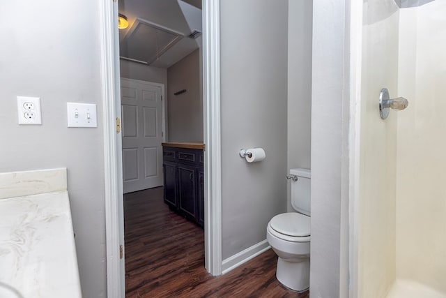 bathroom featuring wood-type flooring, vanity, and toilet