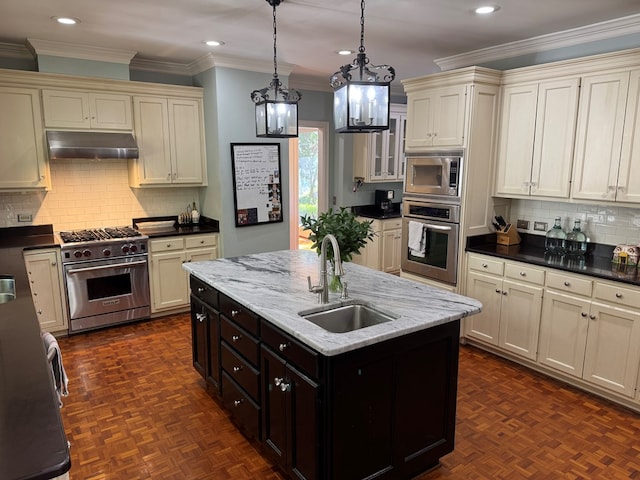1420 Parallel Dr NW, Cairo, GA 39828 - kitchen with cream cabinets, appliances with stainless steel finishes, exhaust hood, and a sink