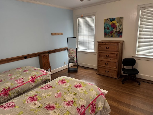 1420 Parallel Dr NW, Cairo, GA 39828 - bedroom with visible vents, baseboards, wood finished floors, and ornamental molding