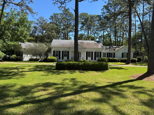 1420 Parallel Dr NW, Cairo, GA 39828 - single story home with french doors, a front lawn, and a chimney