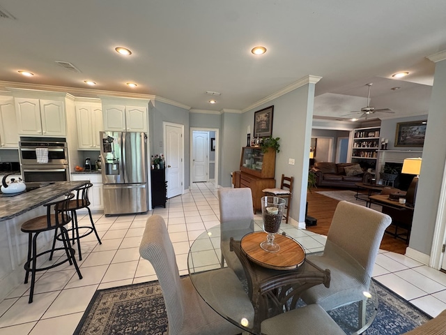 2451 Lake Douglas Rd, Bainbridge, GA 39819 - dining room featuring crown molding, light tile patterned floors, ceiling fan, visible vents, and recessed lighting
