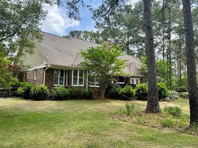 2451 Lake Douglas Rd, Bainbridge, GA 39819 - view of front of house with a front lawn, brick siding, and roof with shingles