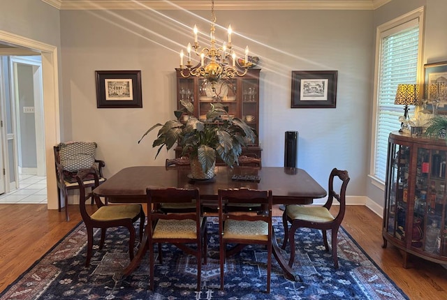 2451 Lake Douglas Rd, Bainbridge, GA 39819 - dining area with a chandelier, wood finished floors, and ornamental molding