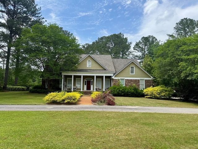 2451 Lake Douglas Rd, Bainbridge, GA 39819 - view of front of home featuring brick siding, a porch, and a front lawn