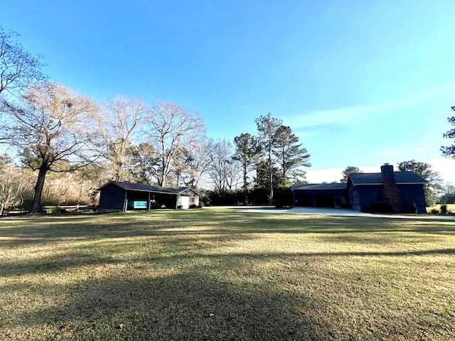 view of yard with a carport