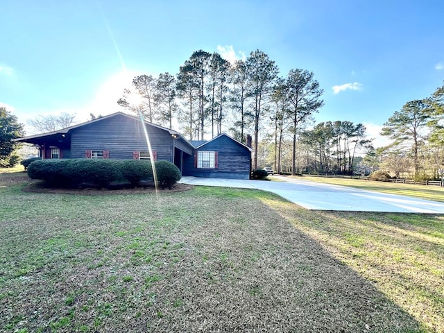 view of property exterior with a lawn