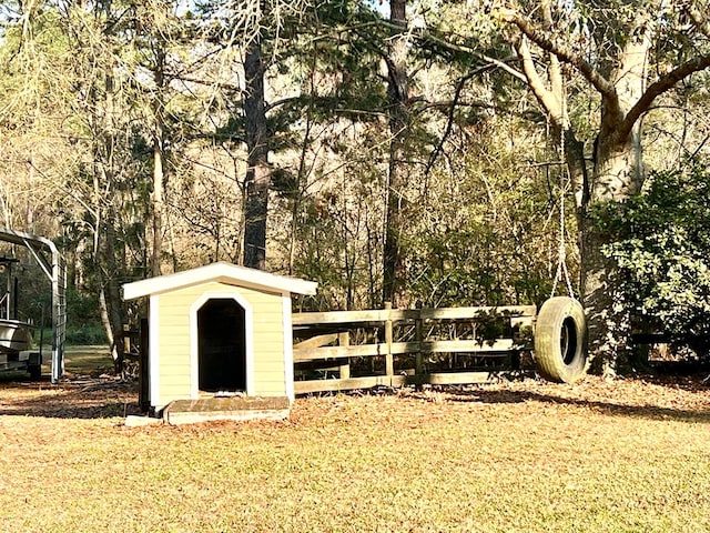 view of shed featuring fence