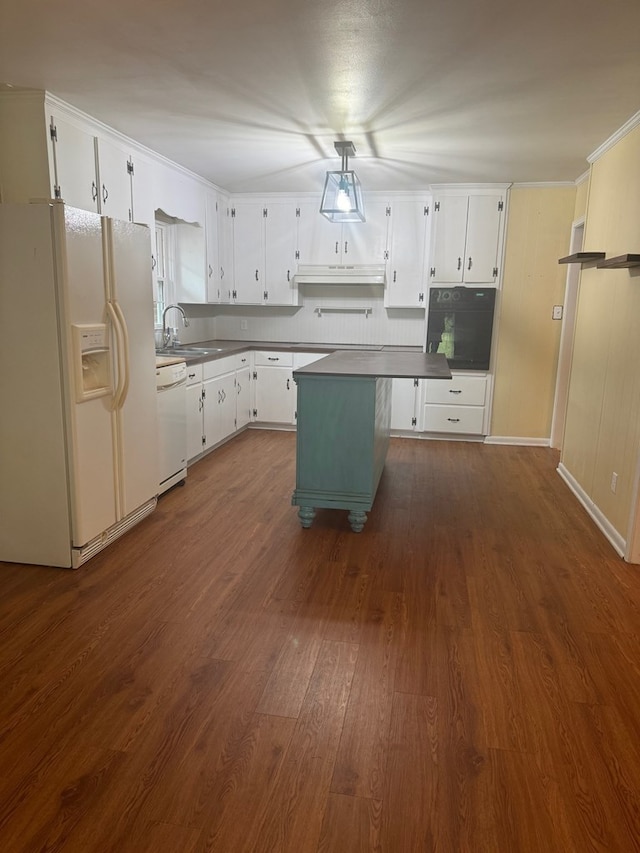 kitchen with white appliances, sink, white cabinets, a center island, and dark hardwood / wood-style floors