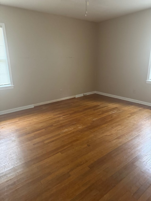 spare room featuring hardwood / wood-style floors