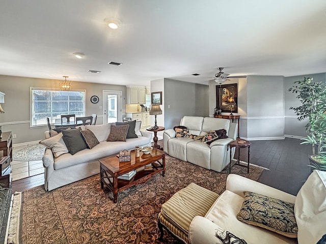living room with hardwood / wood-style flooring and ceiling fan