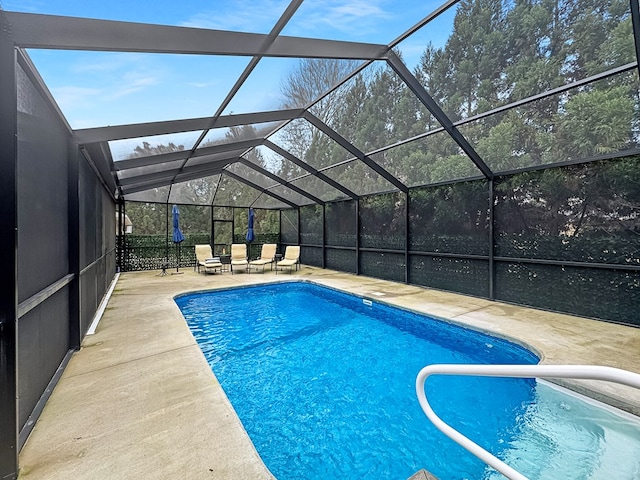 view of pool with a lanai and a patio area