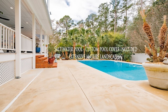 view of swimming pool featuring fence, a fenced in pool, and a patio