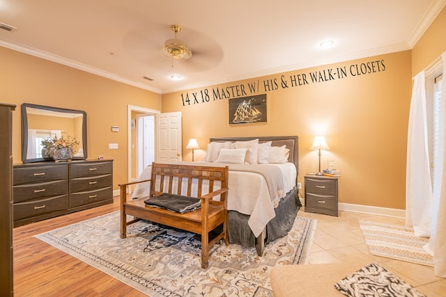 bedroom featuring baseboards, visible vents, a ceiling fan, and crown molding