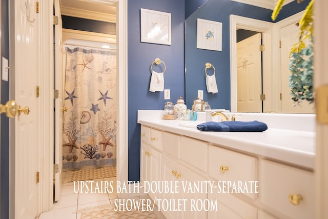 bathroom featuring curtained shower, vanity, and tile patterned floors