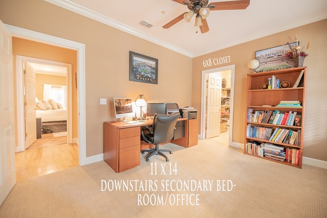 office area featuring ceiling fan, light colored carpet, visible vents, baseboards, and ornamental molding